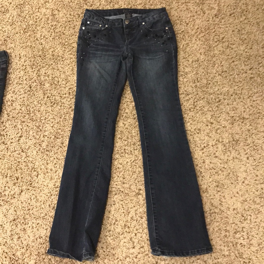 Blue jeans with gem designs.